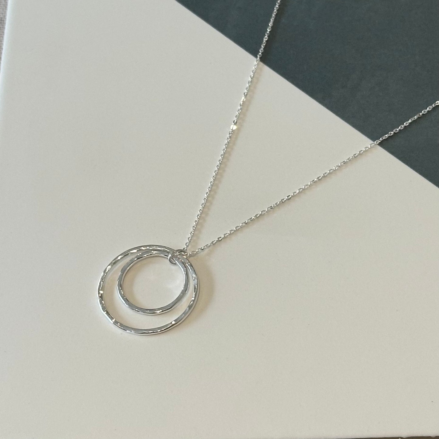 Minimalist silver necklace with hammered texture