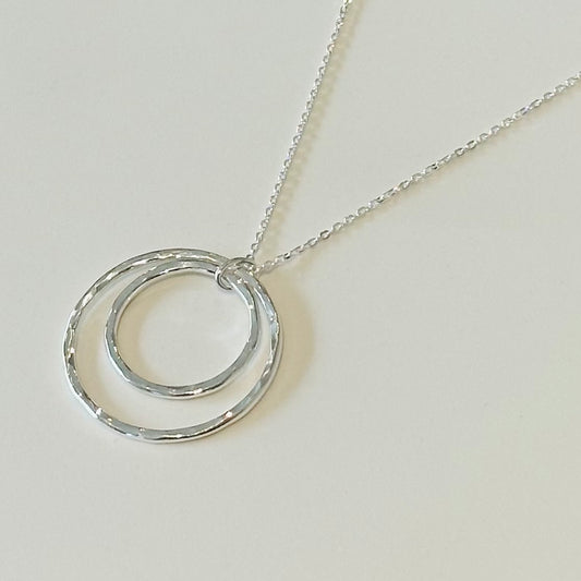 Handmade sterling silver circle pendant on an 18-inch chain