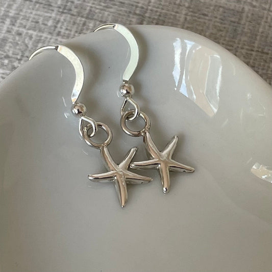 Handmade sterling silver starfish earrings on sterling silver ear wires, featuring a 15mm drop and 10mm width