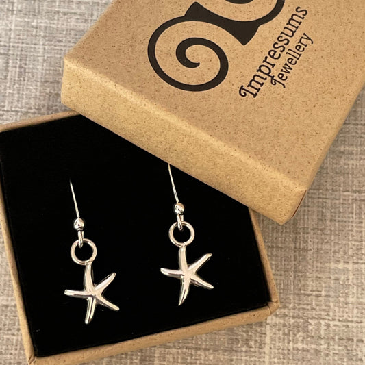 Handmade sterling silver starfish earrings presented in an Impressums Jewellery branded gift box, ready for gifting