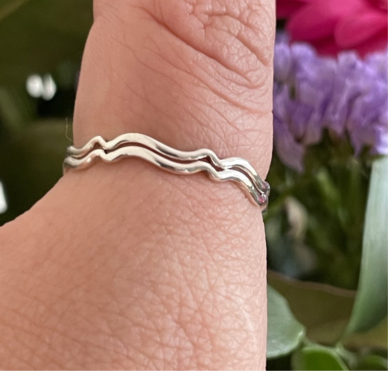 Slim Sterling Silver Stacking Ring Pictured on a Thumb as a thumb ring