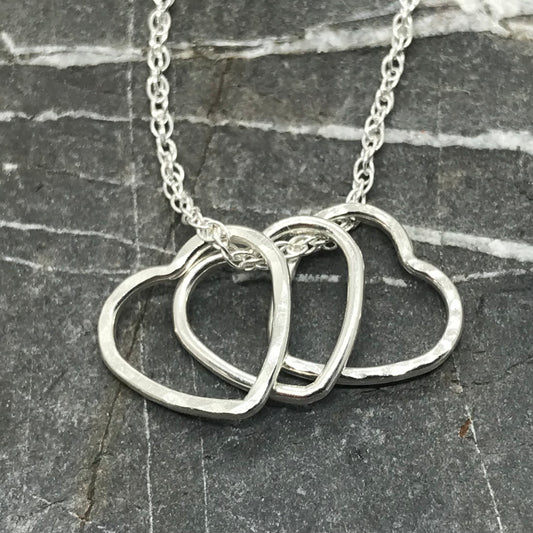 Handmade sterling silver trio heart necklace featuring three delicate charms on an 18-inch (46cm) silver rope chain
